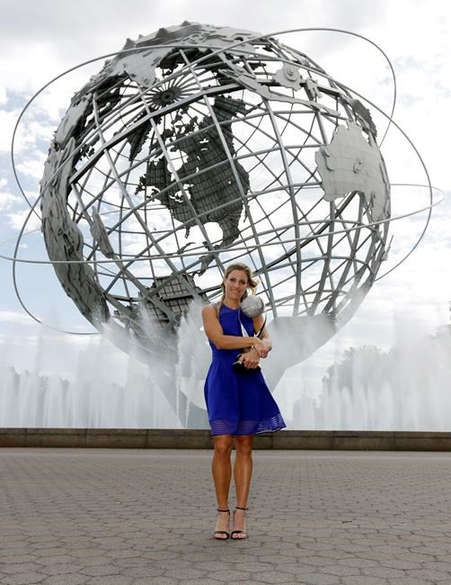 Angelique Kerber of Germany poses with the WTA No. 1 trophy after winning the women's single final at the U.S. Open tennis tournament Sunday Sept. 11 2016 in New York