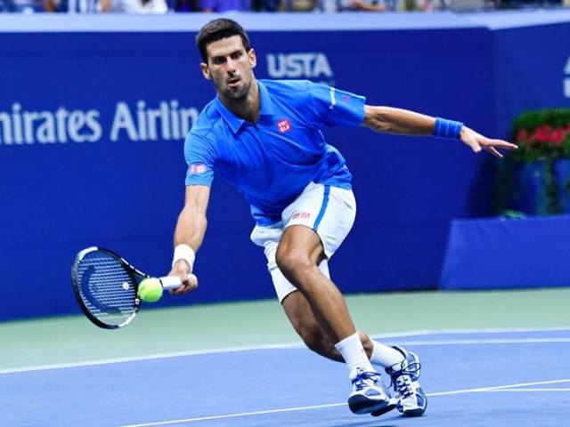 Novak Djokovic hits a return against Jo Wilfried Tsonga in New York