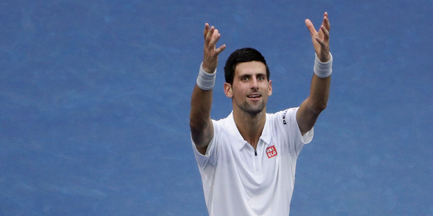 Novak Djokovic of Serbia reacts after defeating Gael Monfils of France during the semifinals of the U.S. Open tennis tournament