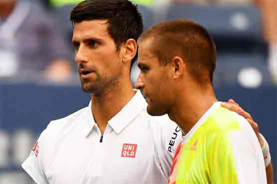 Novak Djokovic reached the US Open last 16 as Mikhail Youzhny retired at 2-4 down in the first set