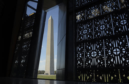 The Washington Monument is framed by a window at the National Museum of African American History and Culture in Washington Wednesday Sept. 14 2016