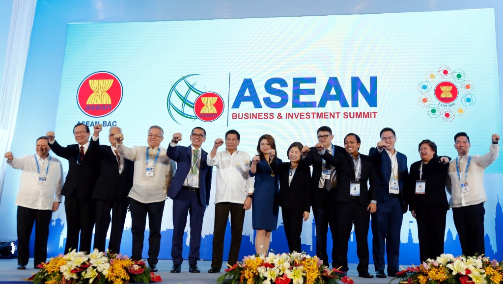 President Rodrigo'Rody Duterte together with some Cabinet members and business leaders poses for