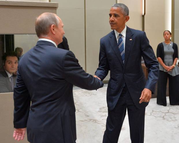 Russian President Vladimir Putin shakes hands with his US countepart Barack Obama during a meeting on the sidelines of the G20 Leaders Summit in Hangzhou