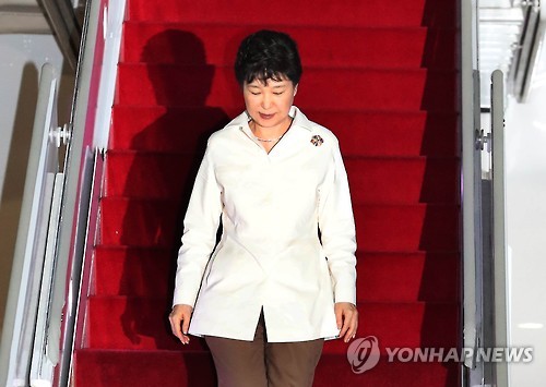 President Park Geun-hye walks downs the stairs from her plane upon arrival at Seoul Air Base a military airport in Seongnam south of Seoul on Sept. 9 2016