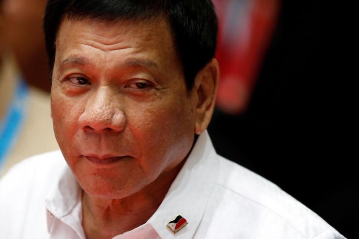 Philippines President Rodrigo Duterte walks between meetings at the ASEAN Summit in Vientiane Laos