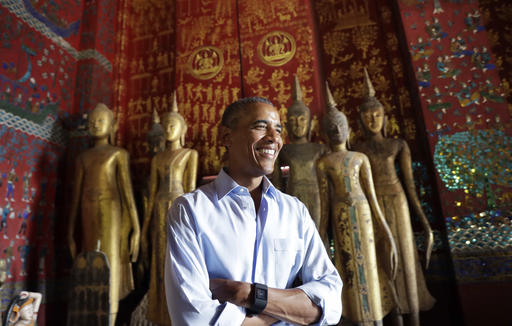 U.S. President Barack Obama pauses in the Ho Raj Rod or Carriage House as he tours the Wat Xieng Thong Buddhist Temple in Luang Prabang Laos Wednesday Sept. 7 2016