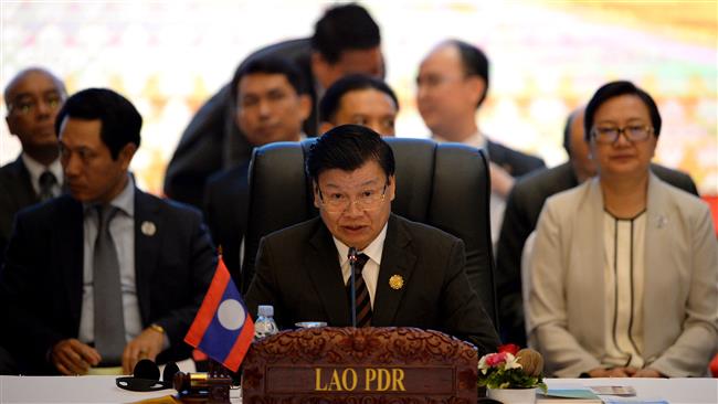 Laos’ Prime Minister Thongloun Sisoulith speaks during the 19th ASEAN-China Summit to commemorate the 25th Anniversary of the ASEAN-China Dialogue Relations in Vientiane Laos