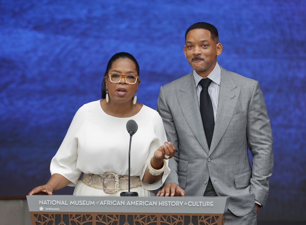 Oprah Winfrey and Will Smith speak at the dedication ceremony for the Smithsonian Museum of African American History and Culture on the National Mall in Washington