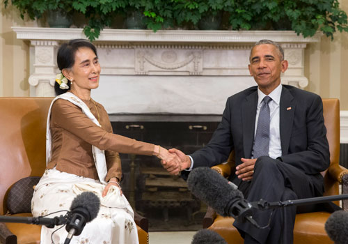 US President Barack Obama listens to State Counsellor Daw Aung San Suu Kyi deliver remarks to the media during their meeting in the Oval Office of the White House on September 14