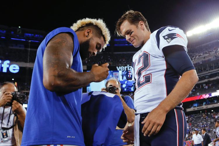 Odell Beckham signs his jersey for Tom Brady