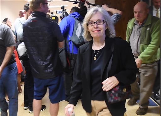 Former state epidemiologist Corinne Miller leaves court room after taking a plea agreement at the 67th District Court in Flint Michigan on Wednesday Sept. 14 2016. Former state epidemiologist Miller pleaded Wednesday to the misdemeanor neglect of duty