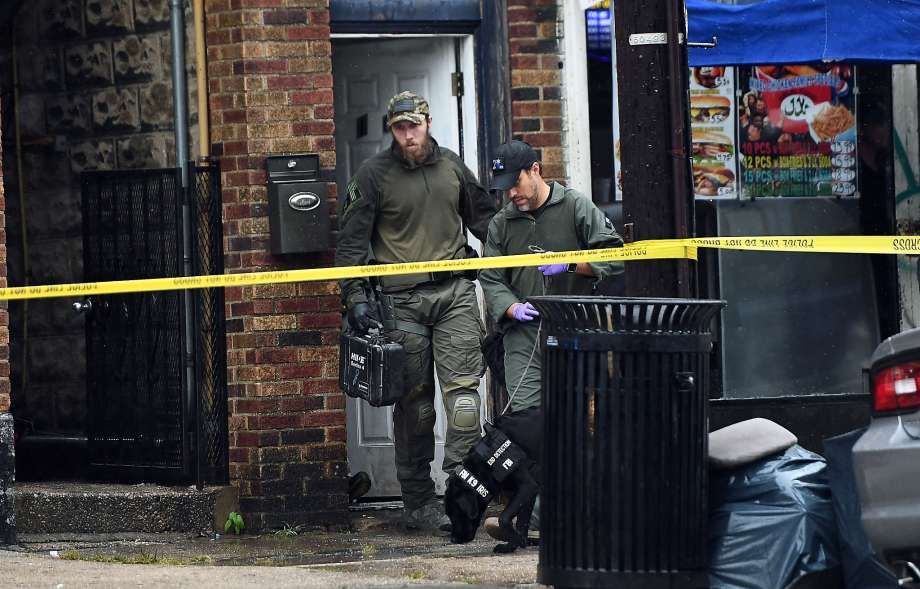 TOPSHOT- Federal Bureau of Investigation officers and canine unit check the family restaurant and adjoined apartment of Ahmad Khan Rahami in Elizabeth New Jersey