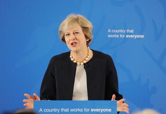 Britain's Prime Minister Theresa May delivers a speech at the British Academy in London where she said that a new wave of grammar schools will end'selection by house price and give every child the chance to go to a good school Friday Sept. 9 201