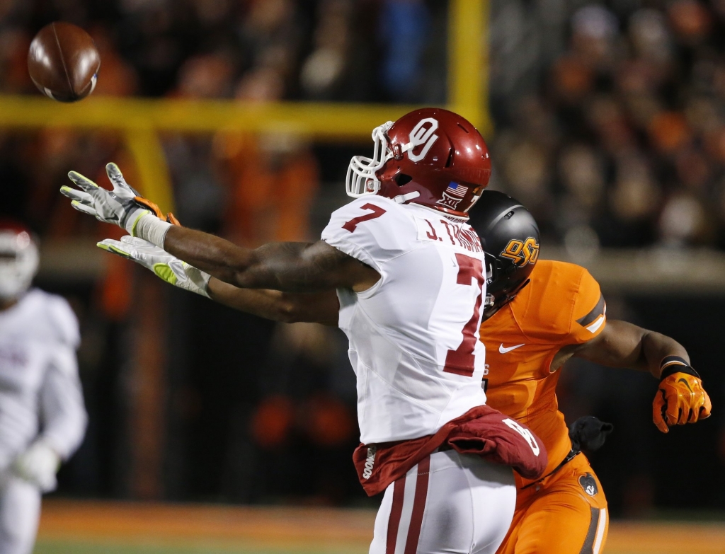 Oklahoma cornerback Jordan Thomas intercepts a pass intended for Oklahoma State's Brandon Sheperd in the second quarter of an NCAA college football game in Stillwater Okla. There's good news and