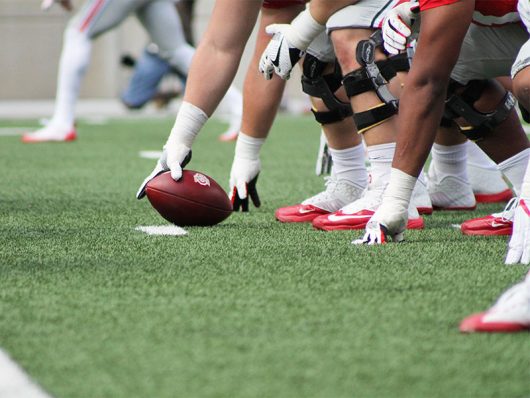 OSU center Pat Elflein wraps his hand around the football during the first game of the 2016 season against Bowling Green on Sept. 3 in Ohio Stadium. The Buckeyes won 77-10. Credit Mason Swires | Assistant