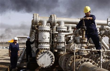 Iraqi laborers work at the Rumaila oil refinery in Zubair near the city of Basra Iraq. Across a Mideast fueled by oil production low global prices have some countries running on empty and scrambling to cover shortfalls