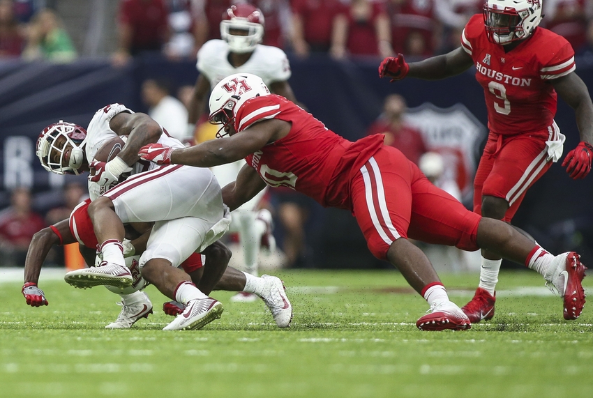 Sep 3 2016 Houston TX USA Houston Cougars defensive tackle Ed Oliver attempts to tackle Oklahoma Sooners running back Joe Mixon during the game at NRG Stadium. Mandatory Credit Troy Taormina-USA TODAY Sports