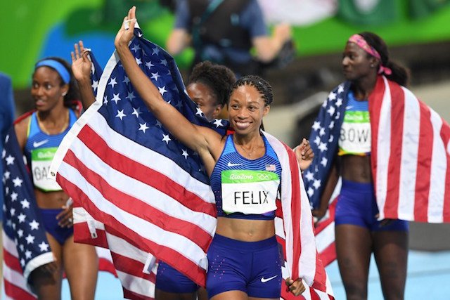 USA's Allyson Felix center celebrates her team's victory at the end of the Women's 4x100m Relay Final during the athletics event at the Rio 2016 Olympic Games at the Olympic Stadium in Rio de Janeiro