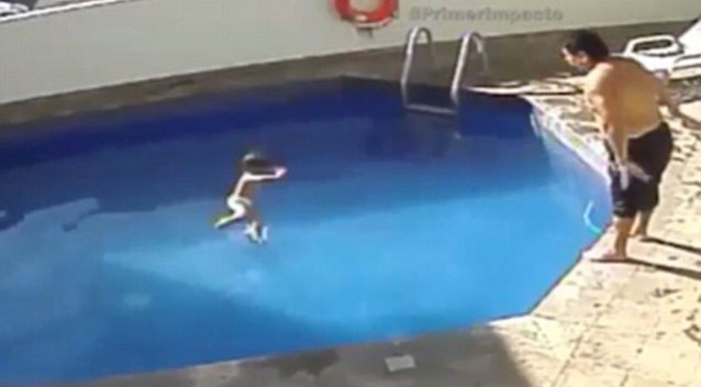 On the footage he can be seen throwing the toddler into the pool then walking away while the child struggles to float and swim. Source Supplied