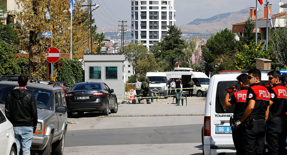 A bomb disposal expert prepares to examine a bag in front of the Israeli Embassy in Ankara Turkey