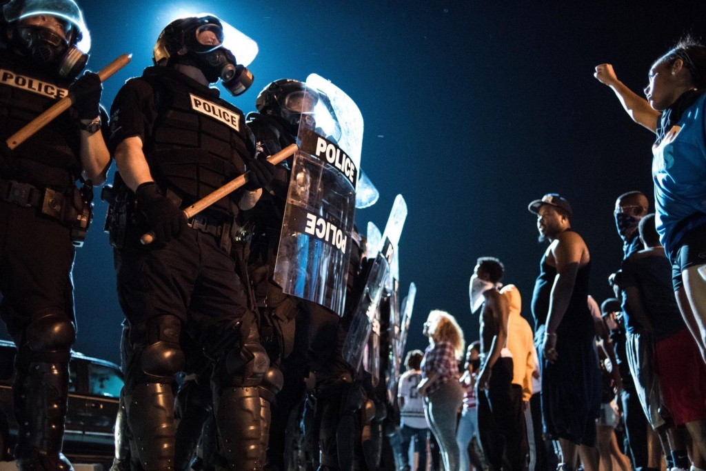 Police officers face off with protesters on the I-85 during protests following the death of a black man 43-year-old Keith Lamont Scott shot by a black police officer on Sept. 21 2016 in Charlotte N.C