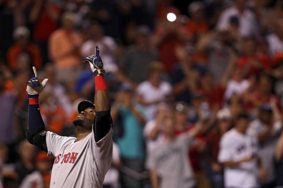 BALTIMORE MD- SEPTEMBER 20 David Ortiz #34 of the Boston Red Sox celebrates a three run home run during the seventh inning against the Baltimore Orioles at Oriole Park at Camden Yards