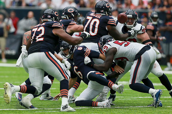 HOUSTON TX- SEPTEMBER 11 Jay Cutler #6 of the Chicago Bears fumbles as Whitney Mercilus #59 of the Houston Texans strips the ball at NRG Stadium