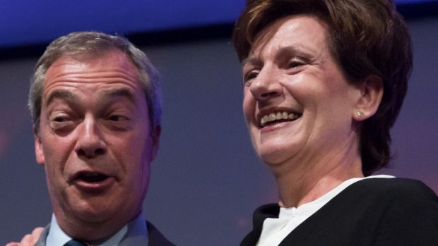 Outgoing UKIP leader Nigel Farage congratulates MEP Diane James after she was announced as the new leader of UKIP