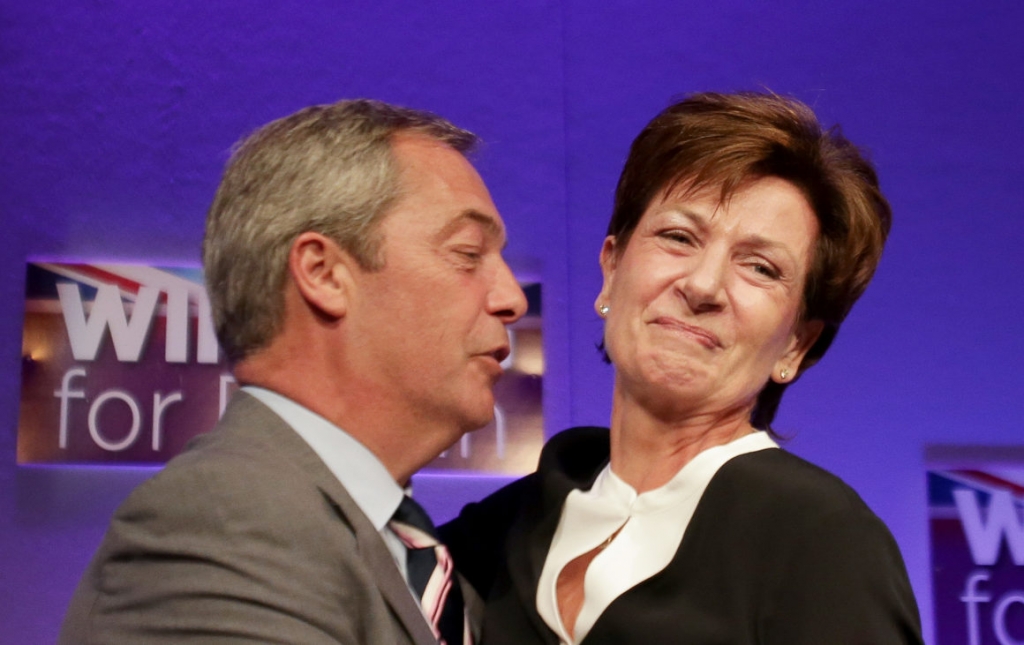 Outgoing leader Nigel Farage embraces new UKIP chief Diane James | Daniel Leal-Olivas  AFP via Getty Images