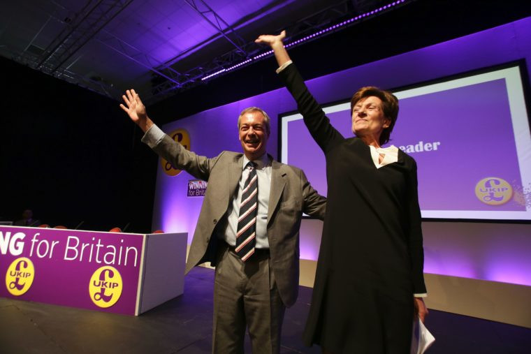 Outgoinng leader Nigel Farage looks on as he introduces new leader of Ukip Diane James