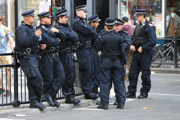 Police presence on Kensington Park Road London as thousands more partygoers are expected to head to the second and final day of the Notting Hill Carnival