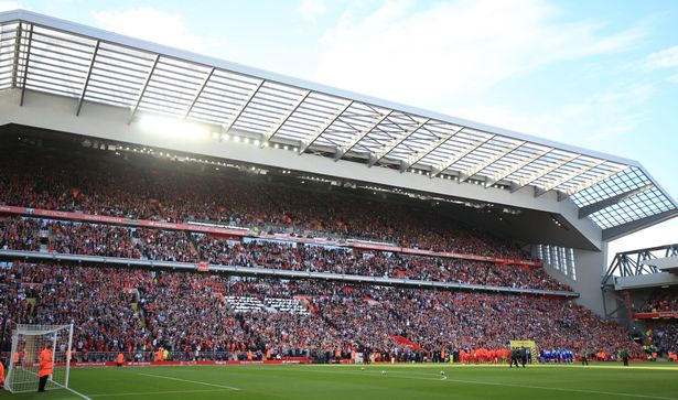 Liverpool and Leicester City players walk out in front of the new main stand