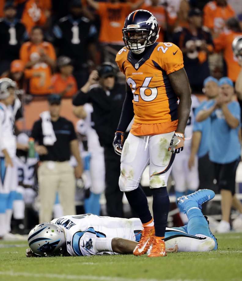 Panthers quarterback Cam Newton lies on the turf after a hit by Broncos safety Darian Stewart late in the fourth quarter