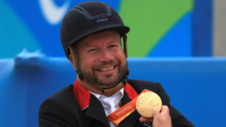 Great Britain's Lee Pearson celebrates with the Gold medal for the Grade IB Independent Freestyle Test during the ninth day of the 2016 Rio Paralympic Game