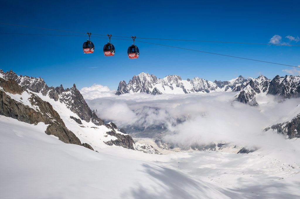 Sixty tourists will spend the night trapped in broken-down cable cars 12000ft up in the French Alps after rescue