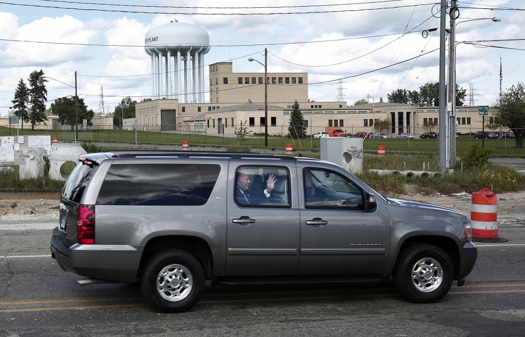 Republican presidential nominee Donald Trump waves to the crowd as he arrives at the Flint Water Treatment Plant for a tour