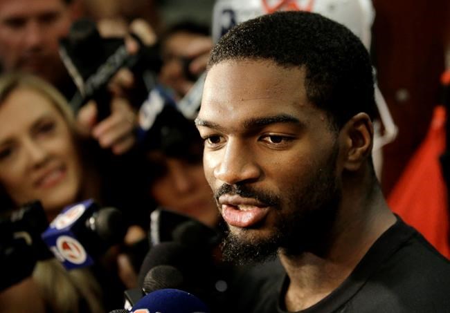 New England Patriots quarterback Jacoby Brissett speaks with members of the media in the team's locker room following NFL football team practice Tuesday Sept. 20 2016 in Foxborough Mass