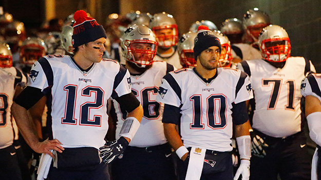 Tom Brady leads the New England Patriots onto the field against the New York Jets at Met Life Stadium