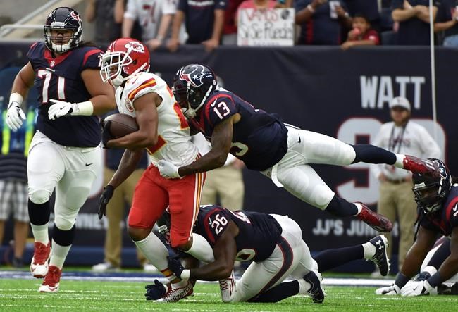 Kansas City Chiefs cornerback Marcus Peters is hit by Houston Texans wide receiver Braxton Miller after his goal line interception during the first half of an NFL football game Sunday Sept. 18 2016 in Houston