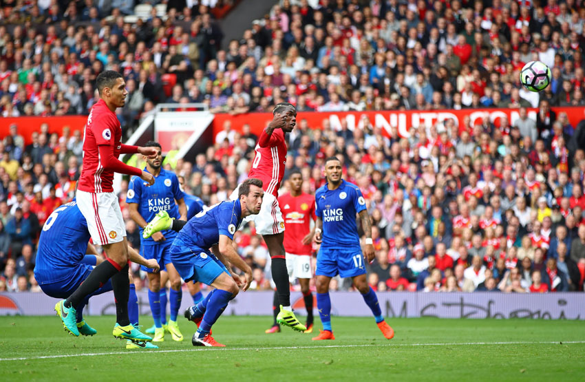 Paul Pogba of Manchester United scores his side's fourth goal