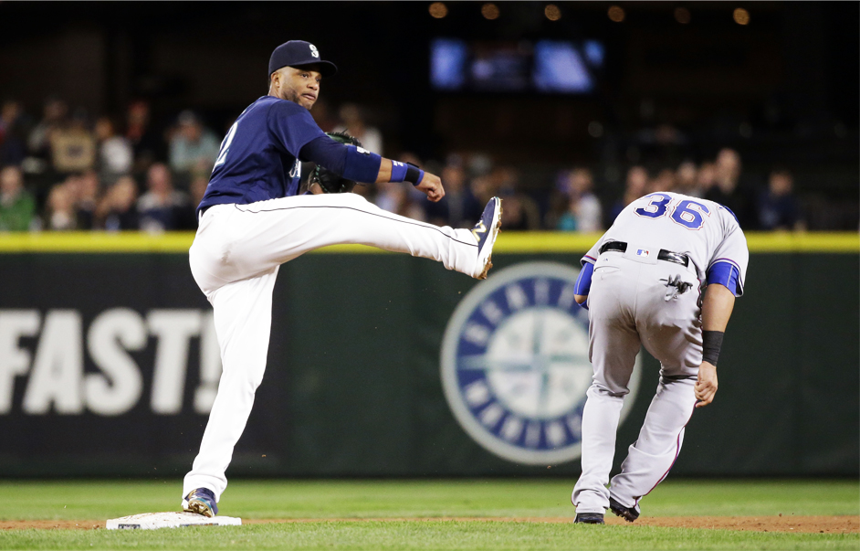 Seattle Mariners second baseman Robinson Cano left watches his throw to first base after forcing out Texas Rangers&#039 Carlos Beltran at second base in the sixth inning of a baseball game Tuesday Sept. 6 2016 in Seattle. Adrian Beltre was safe at