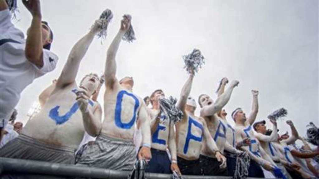 Students with'JOE PATERNO painted across their chests cheer during an NCAA college football game between Penn State and Temple Saturday Sept. 17 2016 at State College Pa. Penn State defeated Temple 34-27 and celebrated the 50th anniversary of form