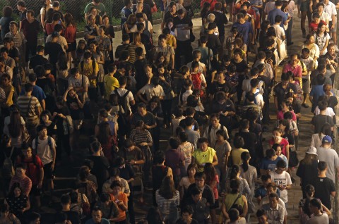 People line up at a polling station to cast ballots for the legislative council election in Hong Kong