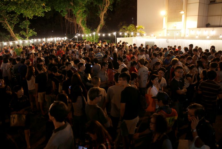 People queue as they wait to cast their votes at a polling station in Hong Kong China