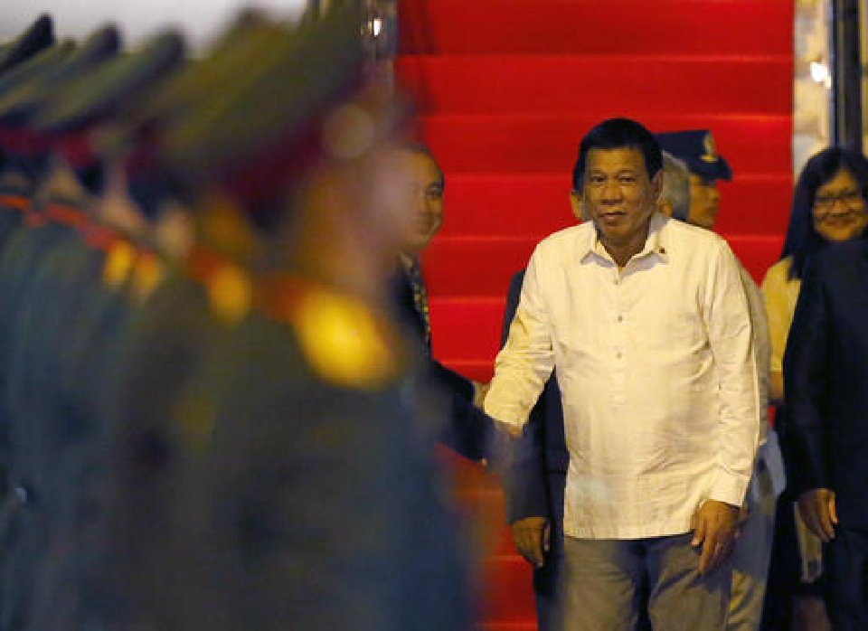 Rodrigo Duterte reviews the troops upon arrival in Vientiane Laos to attend the 28th and 29th ASEAN Summits and other related summits Monday Sept. 5 2016 in Vientiane Laos. Laos is this year's host of the annual regio