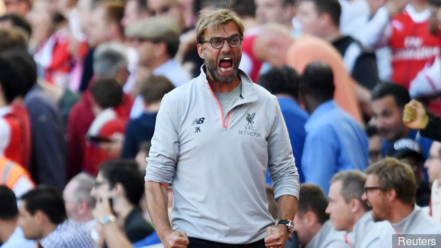 Liverpool manager Juergen Klopp celebrates after Arsenal's Theo Walcott missed a penalty