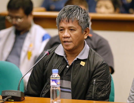 Former Filipino militiaman Edgar Matobato answers questions as he testifies before the Philippine Senate in Pasay south of Manila Philippines on Thursday Sept. 15 2016. Matobato said that Philippine President Rodrigo Duterte