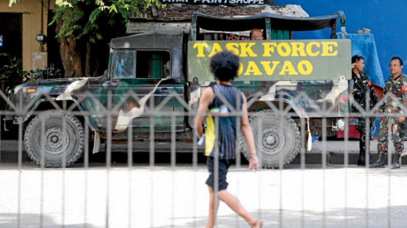 TIGHT SECURITY Security forces are scattered all over Davao City as the threat of another terrorist attack remains high following the Sept. 2 blast that left 14 people dead. JEOFFREY MAITEM  INQUIRER MINDANAO