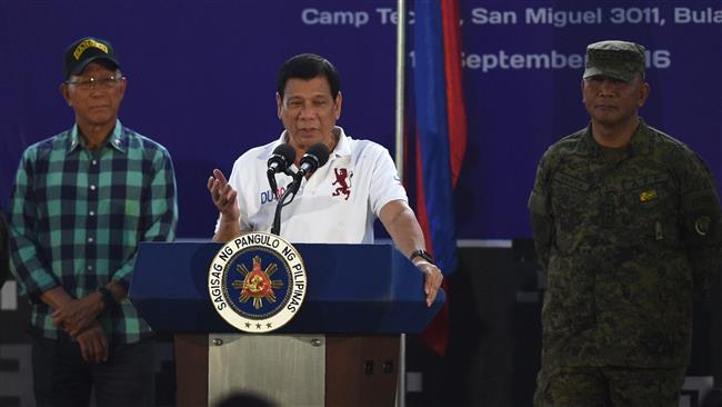 Philippine President Rodrigo Duterte delivers a speech before members of the Scout Rangers regiment at a military training camp in the town of San Miguel Bulacan Province north of Manila