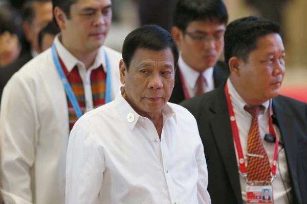 Philippine President Rodrigo Duterte center arrives at the National Convention Center for scheduled bilateral meetings with ASEAN leaders Sept. 6 2016 in Vientiane Laos